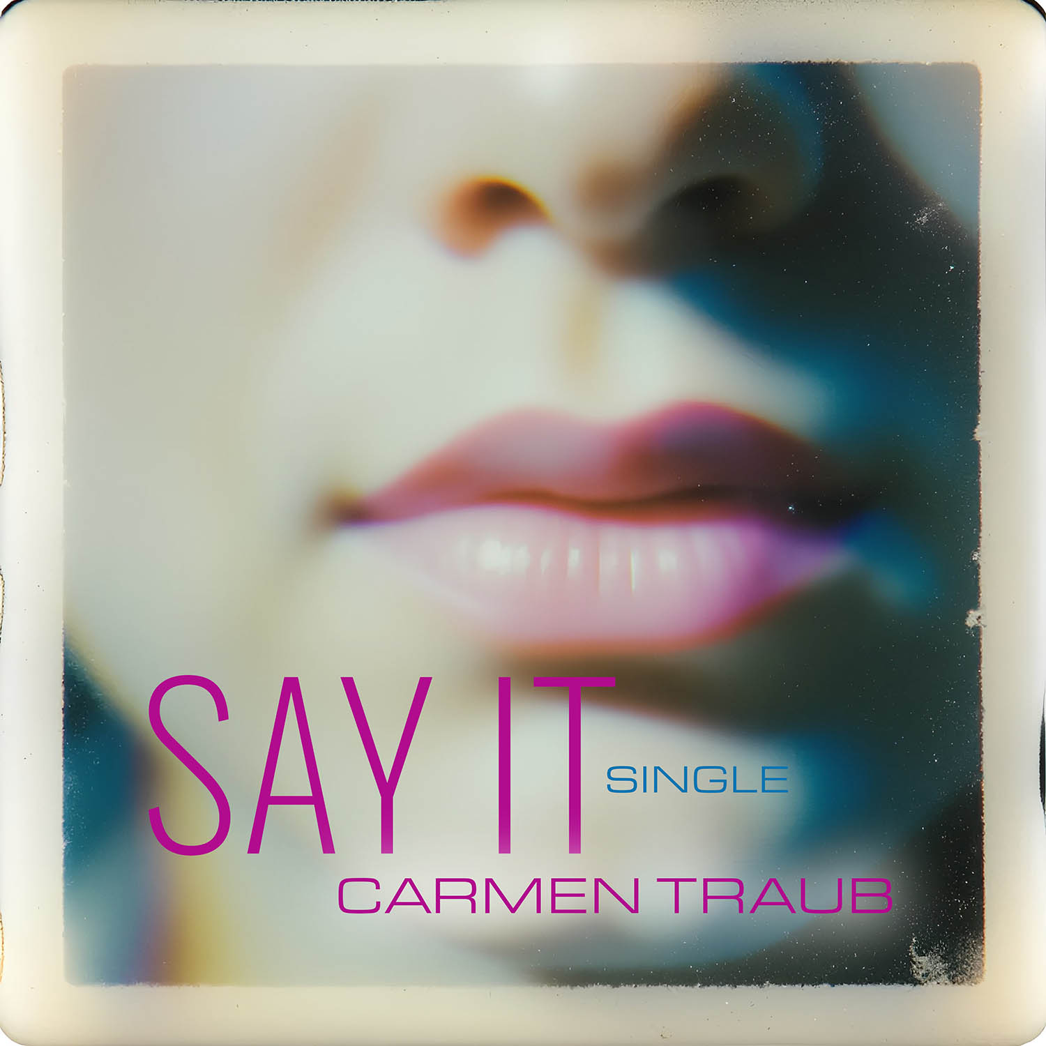 Album cover for Carmen Traub's song "Say It". A polaroid photo fo a girl's mouth and nose with the text SAY IT overtop.